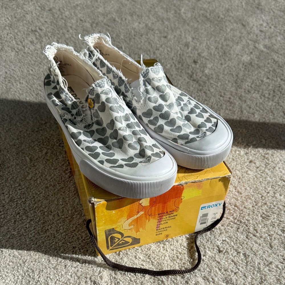 Roxy White Slip-On Sneakers with Silver Heart Print